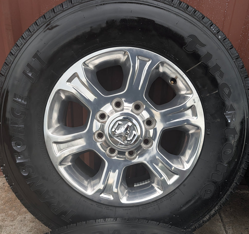 Polished Aluminum Ram 2500 / 3500 OEM 18” Wrapped in Firestone Transforce HT LT275/70R18