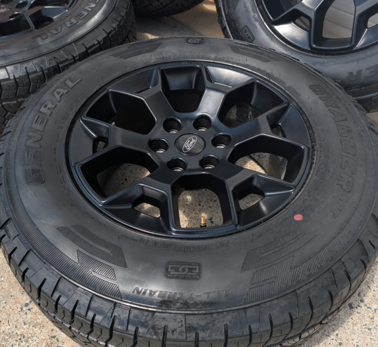 Matte Black Ford F-150 Tremor OEM 18” Wrapped in General Grabber APT LT265/70R18