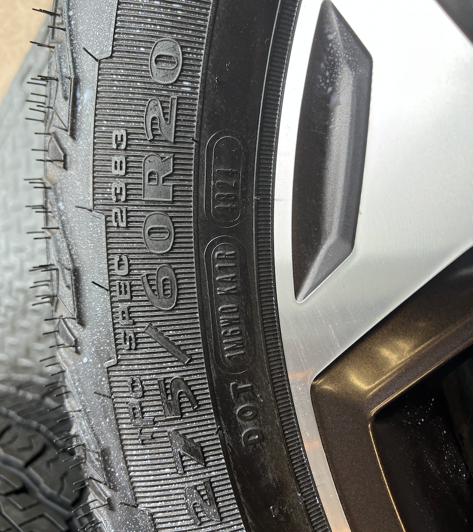 OEM 20”  Wheels wrapped in Goodyear Wrangler Territory AT tires.