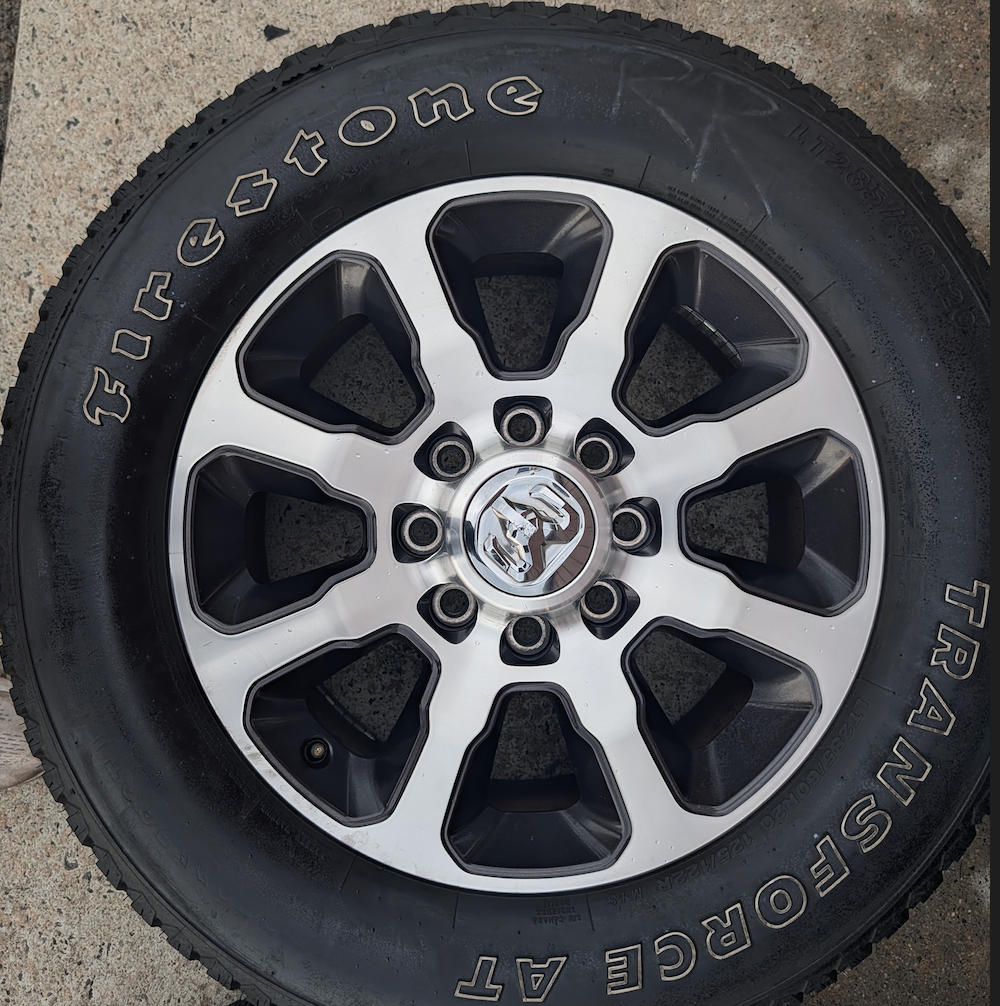 Machined 2500 / 3500 Laramie Longhorn OEM 20” Wrapped in Firestone Transforce A/T LT285/60R20