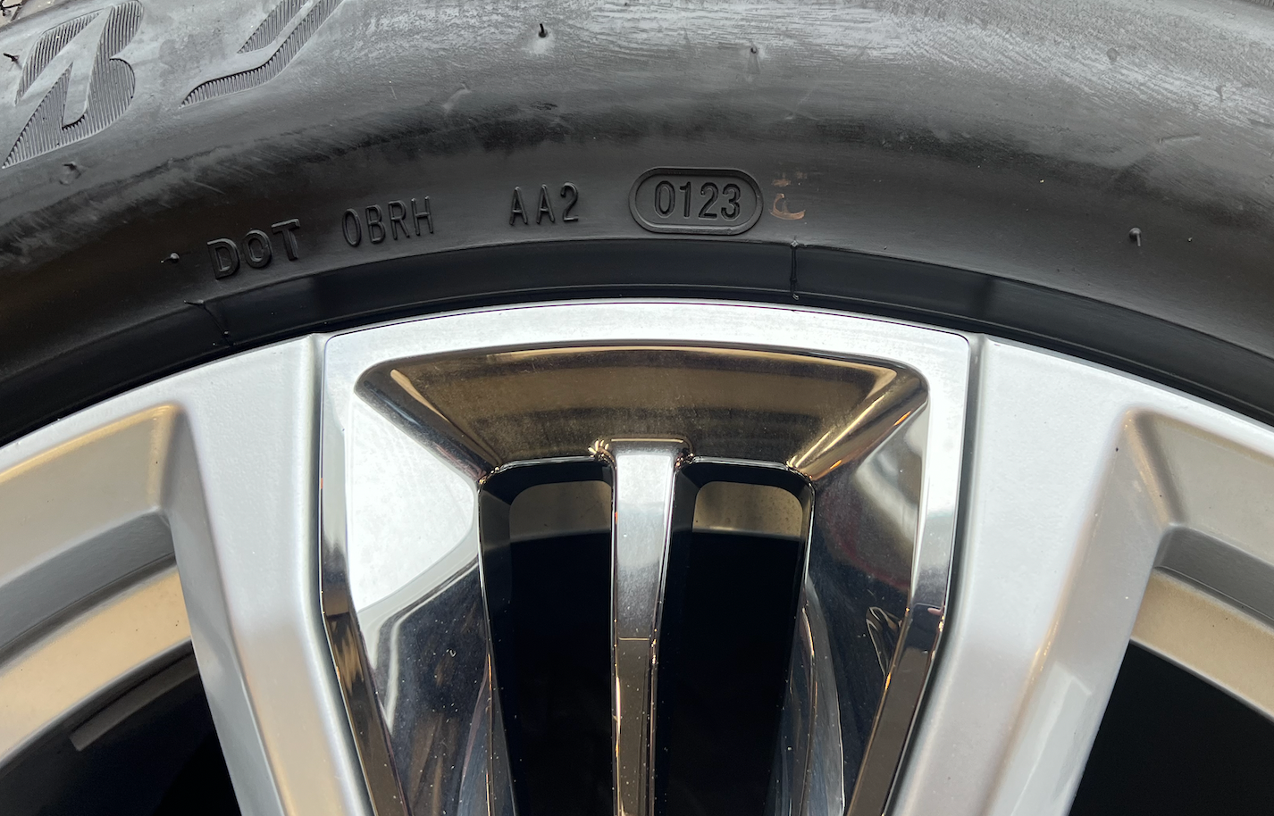 OEM 22” Chevrolet High Country Wheels wrapped in Bridgestone tires.