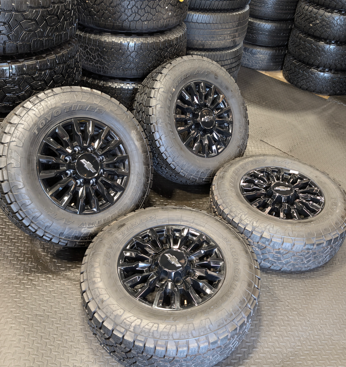 OEM 18” Chevrolet Silverado ZR2 2500HD / 3500HD Gloss Black Wheels wrapped in Toyo Open Country A/T tires.