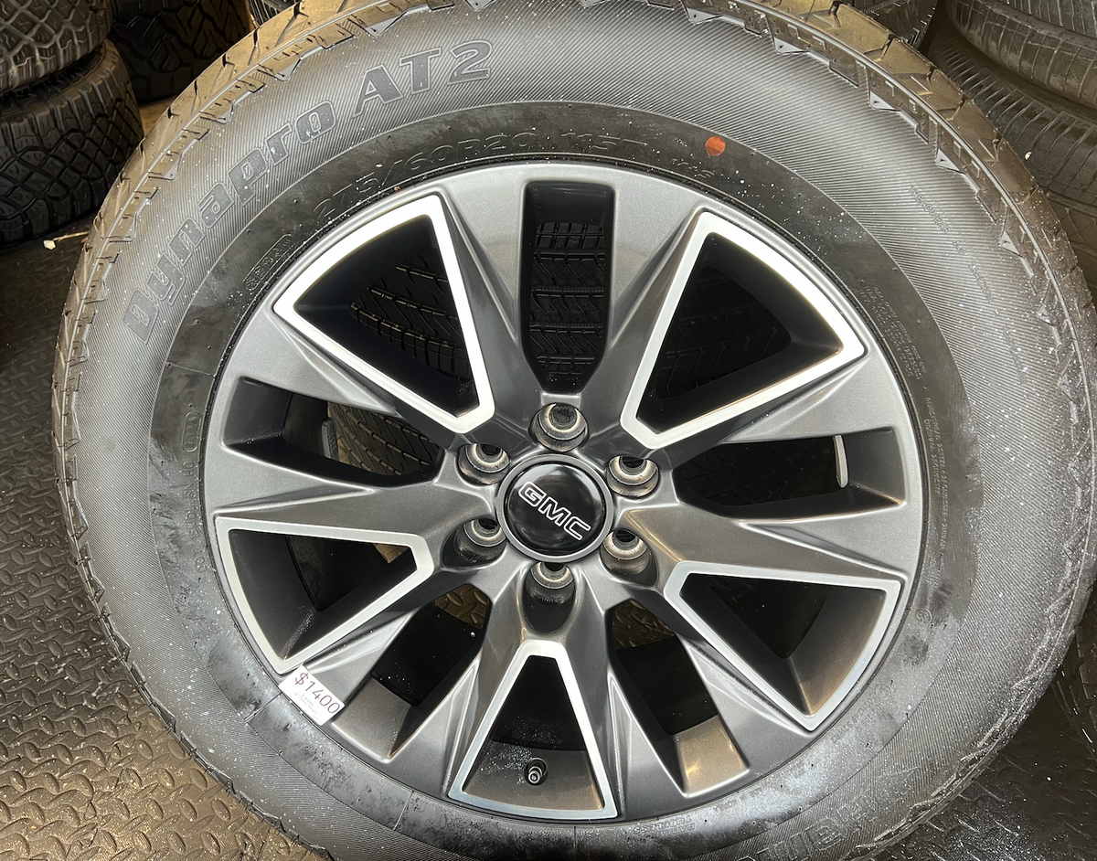 OEM 20” Wheels wrapped in Hankook Dynapro AT2 tires.