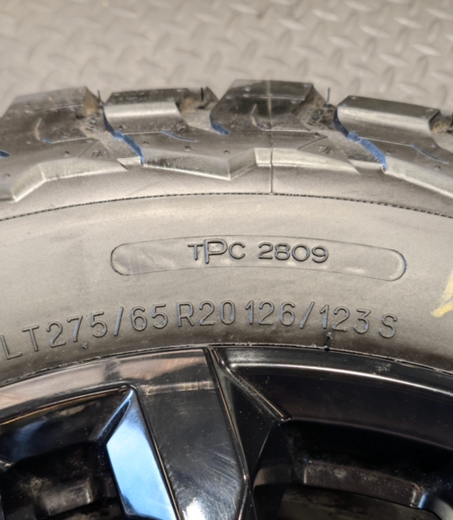 OEM 20” Black GM 2500HD / 3500HD Wheels wrapped in LT275/65R20 BFGoodrich All-Terrain T/A tires.