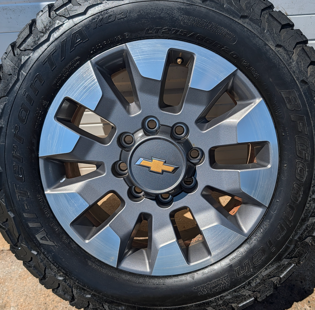 OEM 20” Chevrolet Silverado 2500HD / 3500HD Wheels with Machined Grey Finish wrapped in LT275/65R20 BFGoodrich All-Terrain T/A KO3 tires.