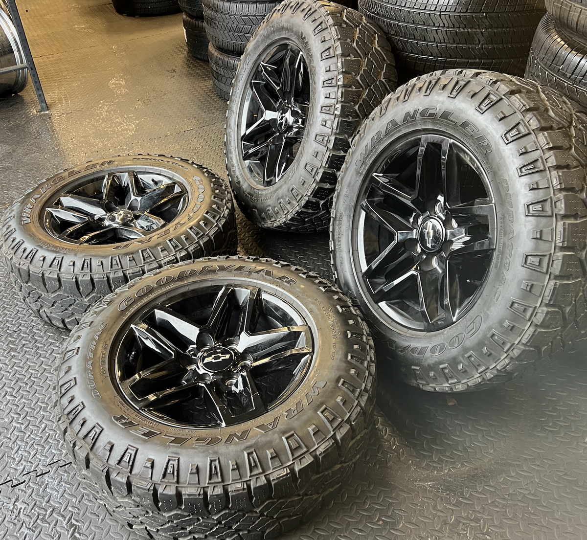 Gloss Black Chevrolet Silverado 1500 Trail Boss OEM 18” Wrapped in Goodyear Wrangler DuraTrac 275/65R18