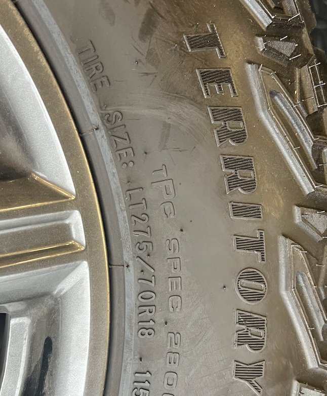 OEM 18” AT4X machined aluminum Wheels wrapped in Goodyear Wrangler Territory M/T tires.