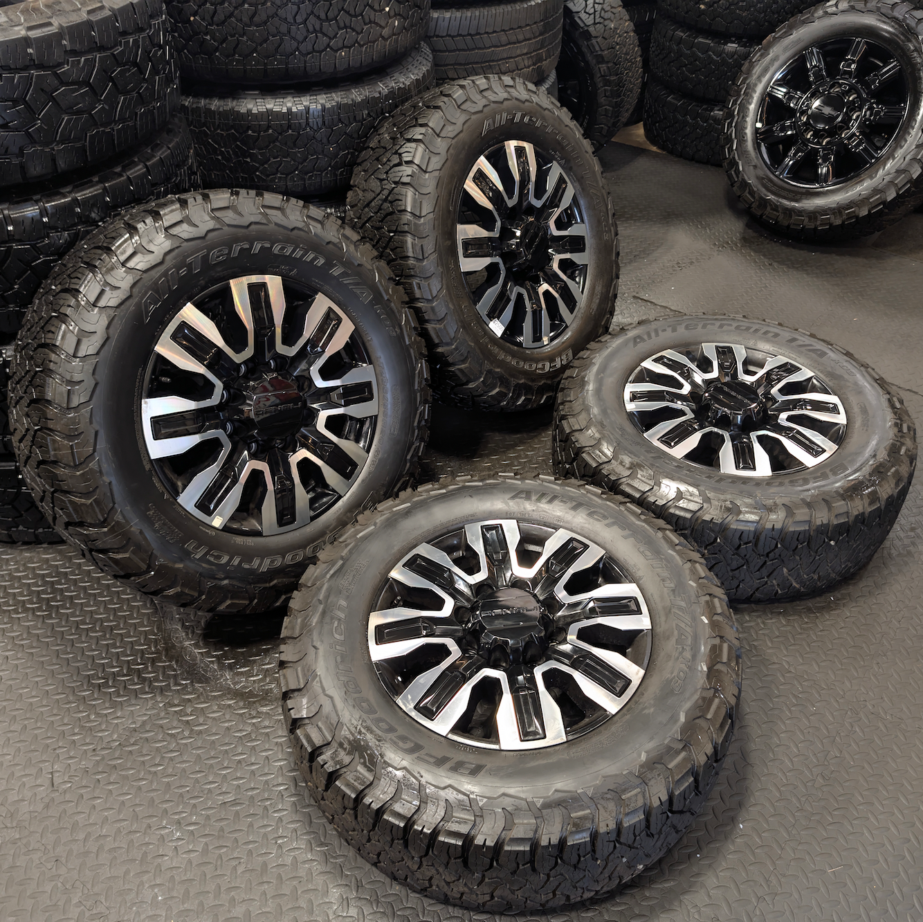 OEM 20” GMC Sierra Denali Ultimate 2500HD / 3500HD Machined Wheels wrapped in BFGoodrich All-Terrain T/A KO3 tires.