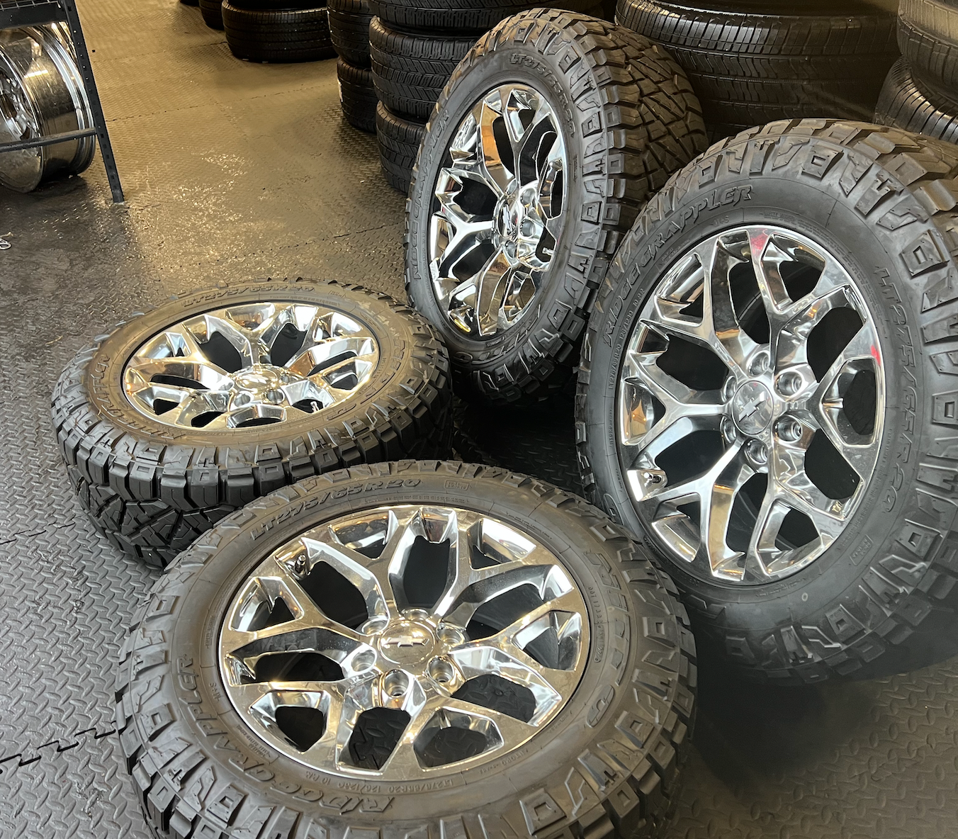 OEM 20” Chrome Truck Wheels wrapped in Nitto Ridge Grappler tires.