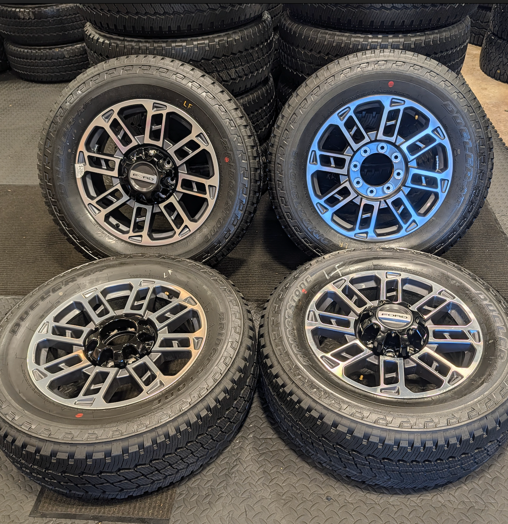 OEM 20” Ford Limited / Platinum Wheels wrapped in Bridgestone Dueler tires.