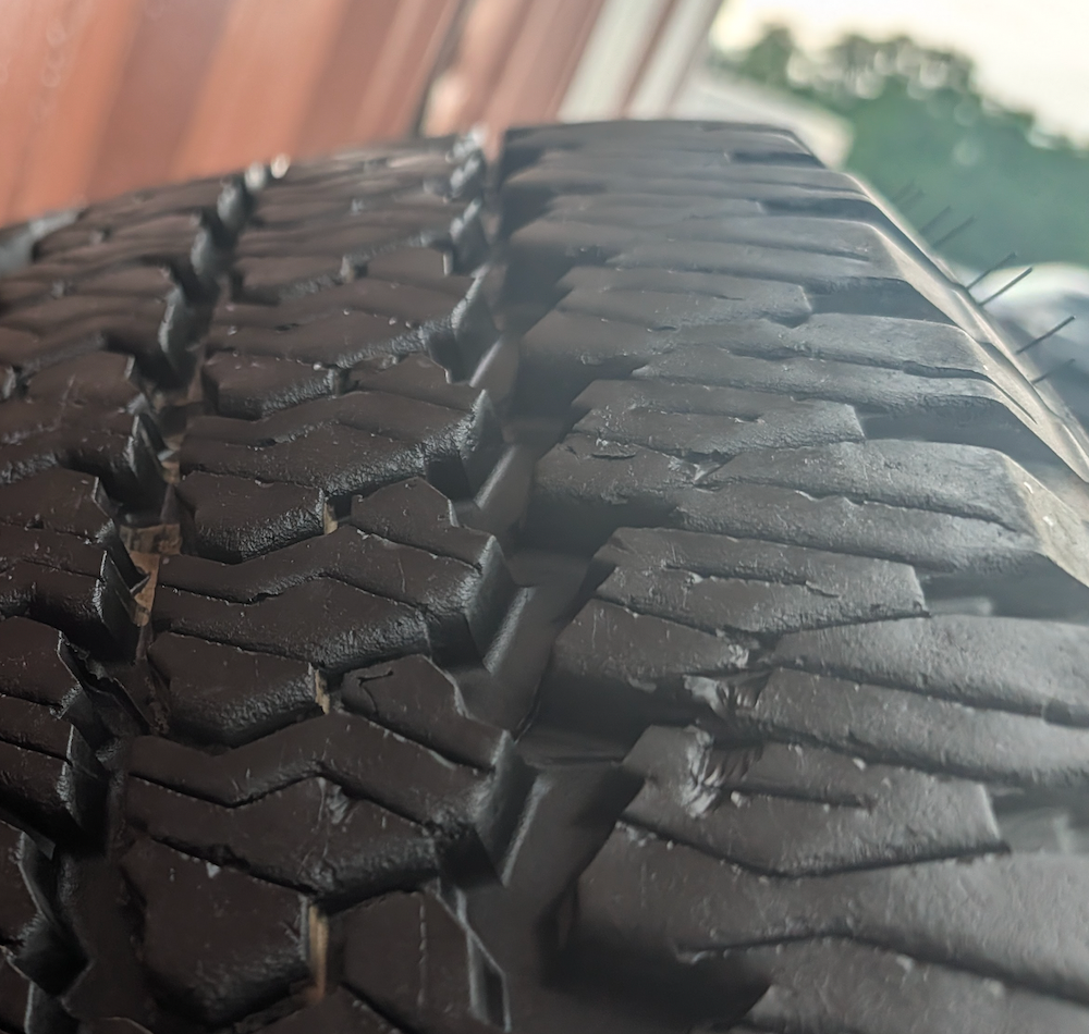 Matte Black Ram 2500 / 3500 OEM 20” Wrapped in Firestone Transforce AT2 LT285/60R20
