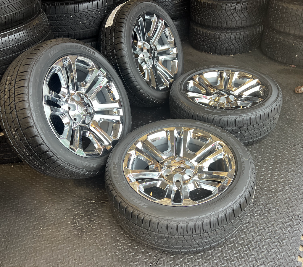 OEM 22” Split 6 Chrome Wheels wrapped in Bridgestone Dueler H/L Alenza tires.
