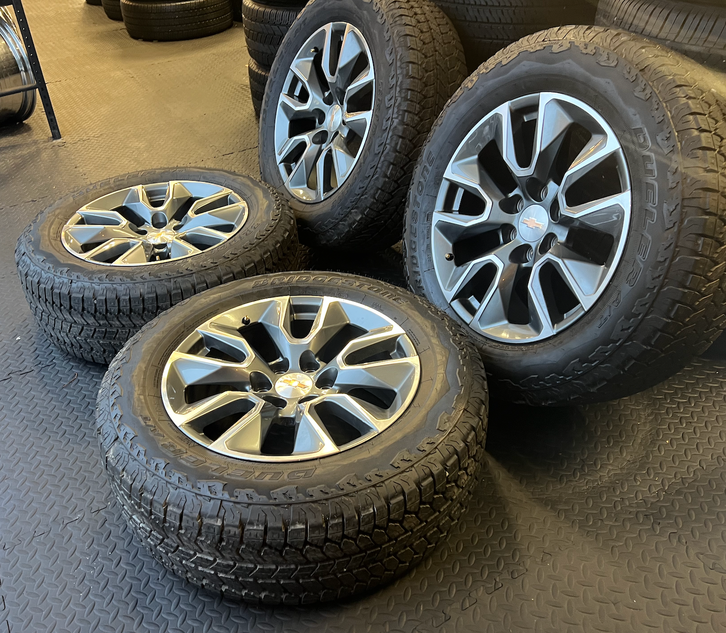 OEM 20” Gunmetal & Machined RST Wheels wrapped in Bridgestone Dueler A/T tires.
