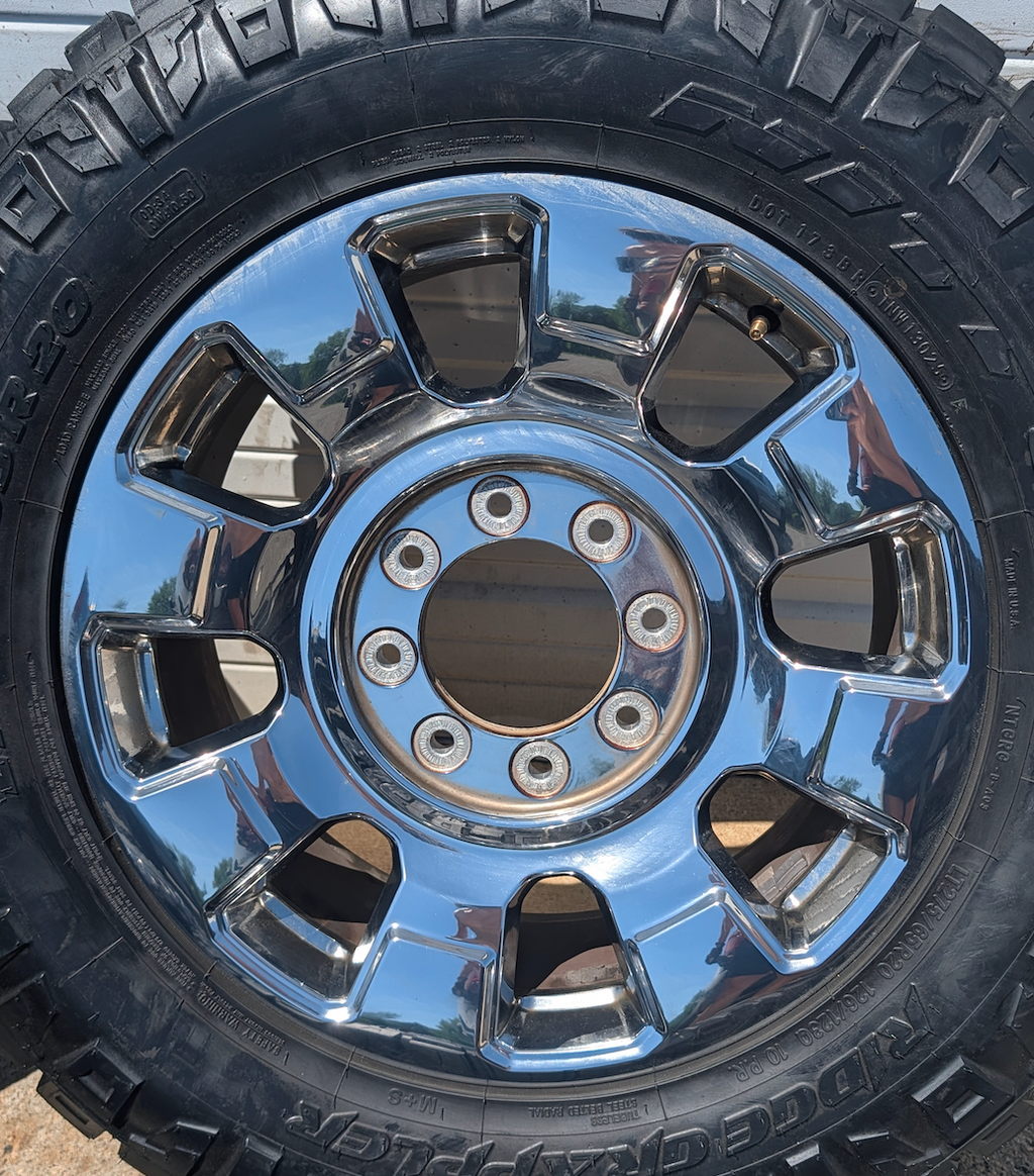 OEM 20” Chrome Ford F-250 / F-350 King Ranch / Lariat Wheels wrapped in LT275/65R20 Nitto Ridge Grappler tires.
