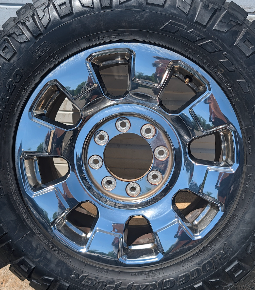 OEM 20” Chrome Ford F-250 / F-350 King Ranch / Lariat Wheels wrapped in LT275/65R20 Nitto Ridge Grappler tires.