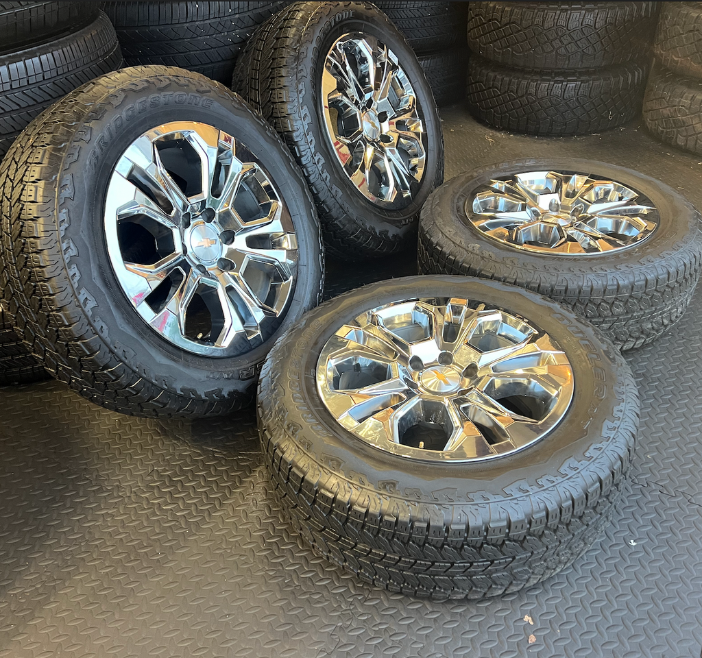 OEM 20” Chrome Wheels wrapped in Bridgestone Dueler tires.