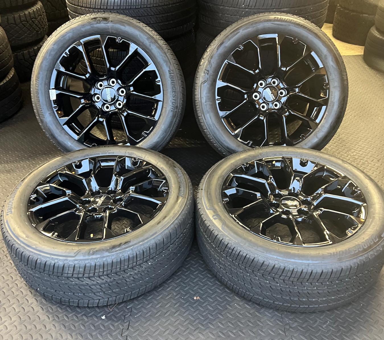 OEM 22” Gloss Black 6-Split-Spoke Replica Wheels wrapped in Bridgestone tires.