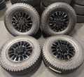 OEM 18” Gloss Black GMC Sierra / Chevrolet Silverado 2500HD & 3500HD Wheels wrapped in Hankook Dynapro XT tires.