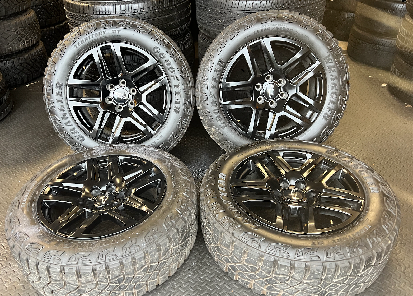OEM 20” Gloss Black Trail Boss Wheels wrapped in Goodyear Wrangler Territory MT tires.