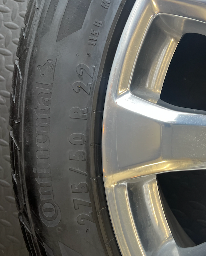 OEM 22”  High Country Polished Aluminum Wheels wrapped in Continental TerrainContact tires.