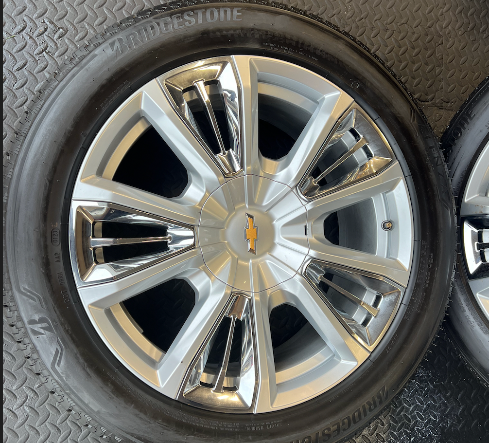 OEM 22” Chevrolet High Country Wheels wrapped in Bridgestone tires.
