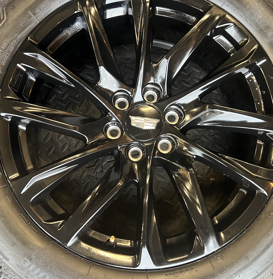 OEM 22” Gloss Black Wheels wrapped in Bridgestone tires.