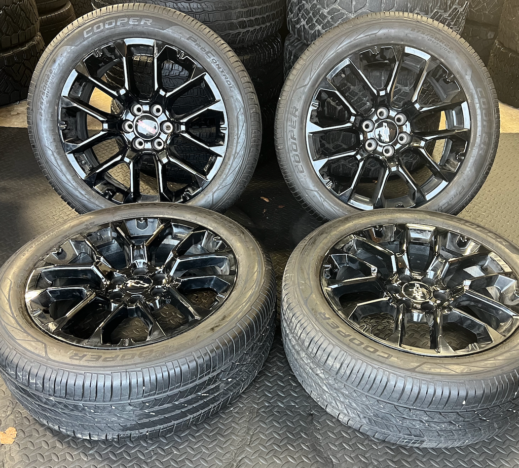OEM 22” Gloss Black Chevrolet Wheels wrapped in Cooper ProControl tires.