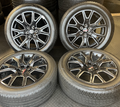 OEM 22” Gloss Black Machined Wheels wrapped in Bridgestone tires.