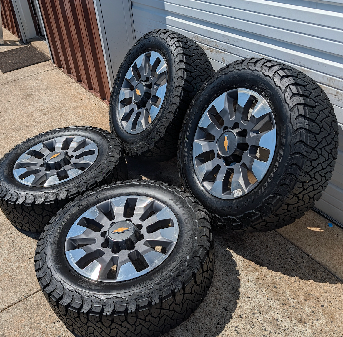 OEM 20” Chevrolet Silverado 2500HD / 3500HD Wheels with Machined Grey Finish wrapped in LT275/65R20 BFGoodrich All-Terrain T/A KO3 tires.