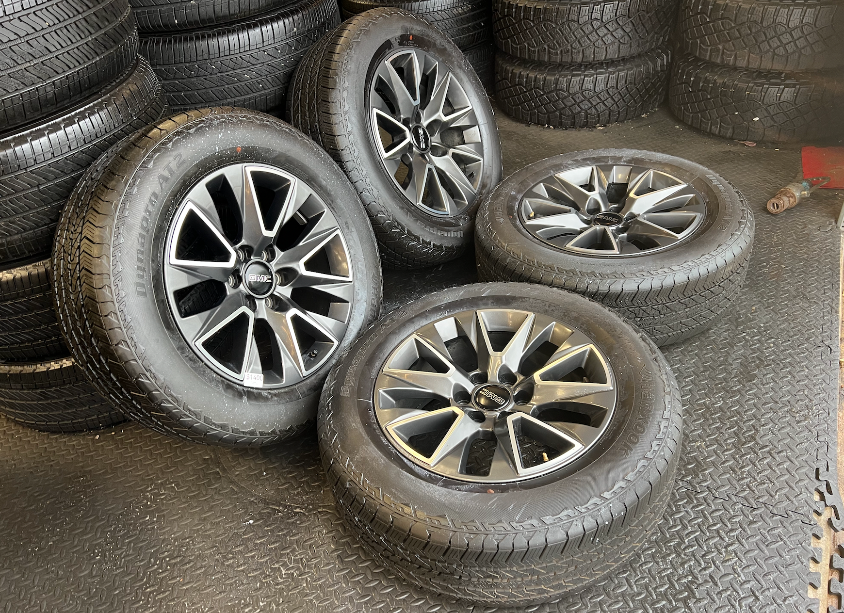 OEM 20” Wheels wrapped in Hankook Dynapro AT2 tires.