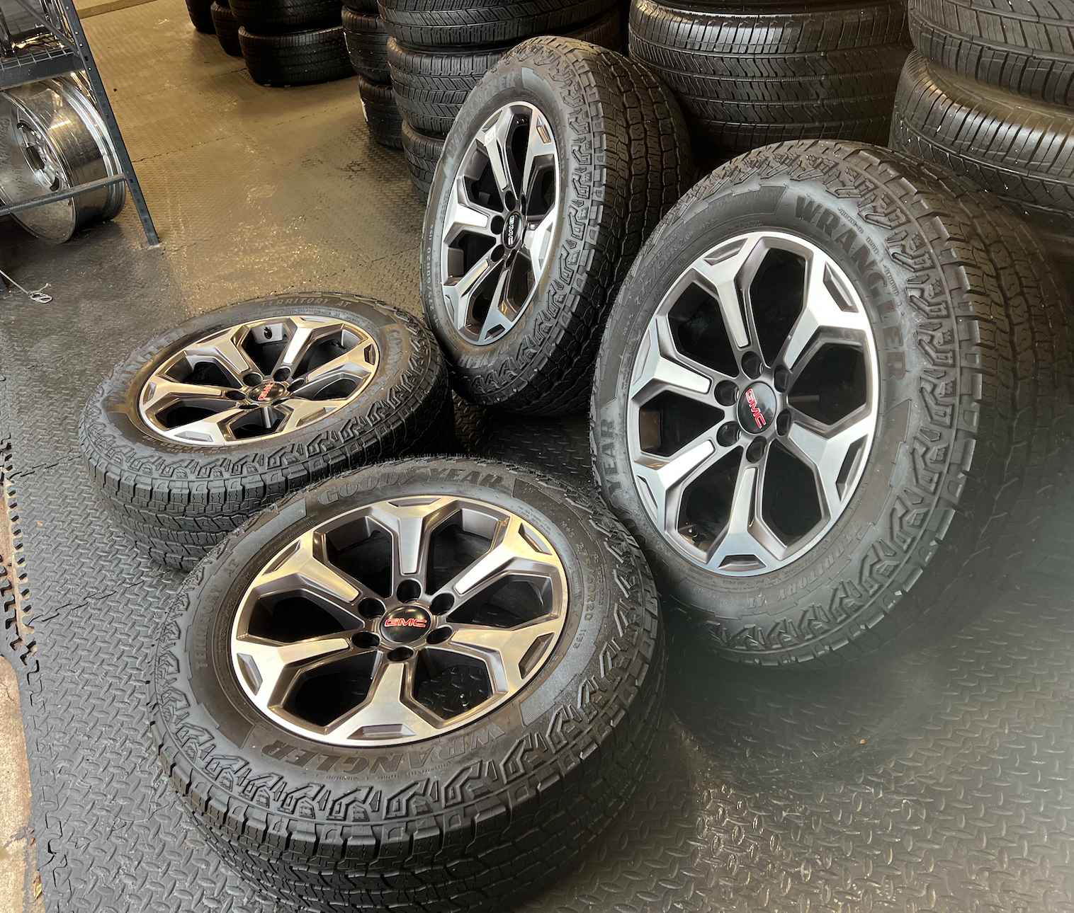 OEM 20”  Wheels wrapped in Goodyear Wrangler Territory AT tires.