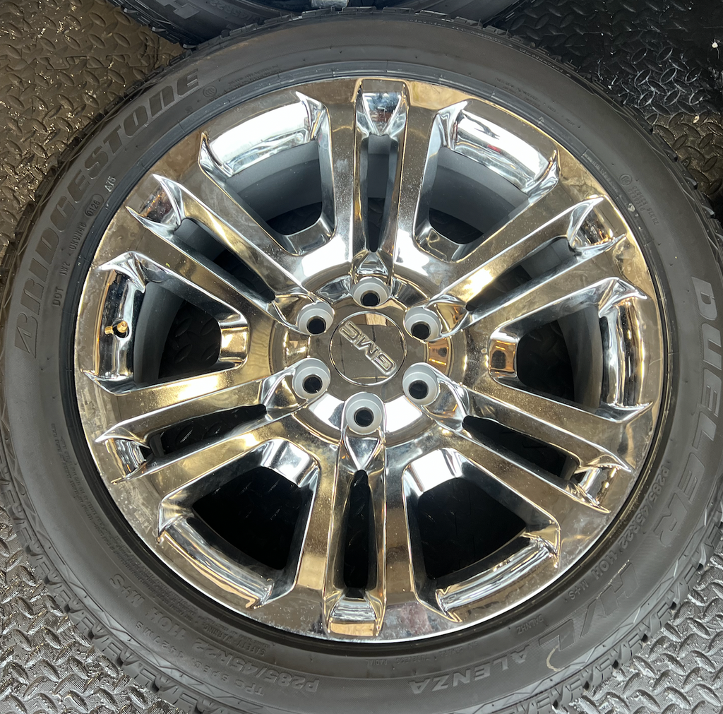 OEM 22” Split 6 Chrome Wheels wrapped in Bridgestone Dueler H/L Alenza tires.