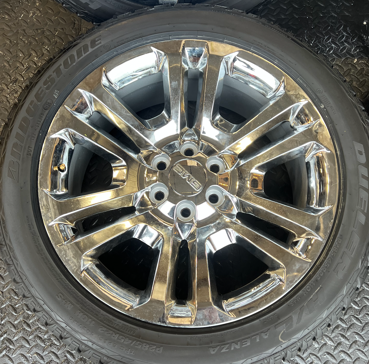 OEM 22” Split 6 Chrome Wheels wrapped in Bridgestone Dueler H/L Alenza tires.