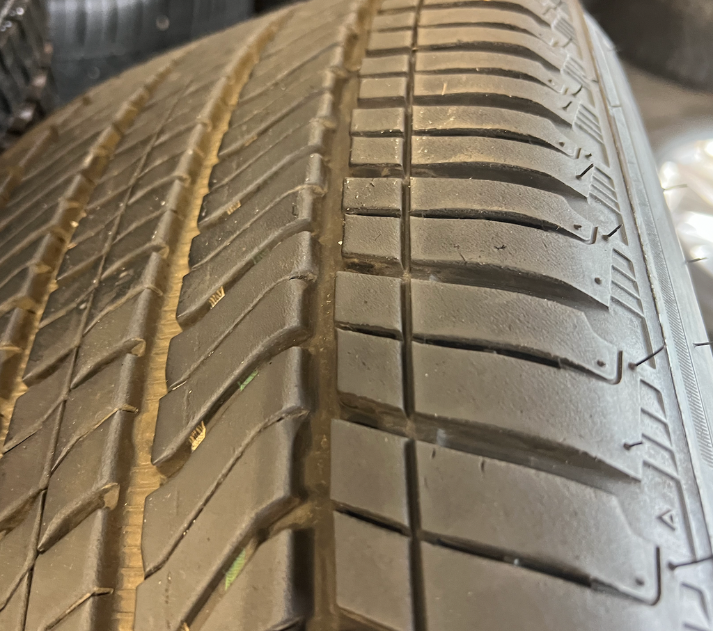 OEM 22” Polished Aluminum Wheels wrapped in Bridgestone tires.