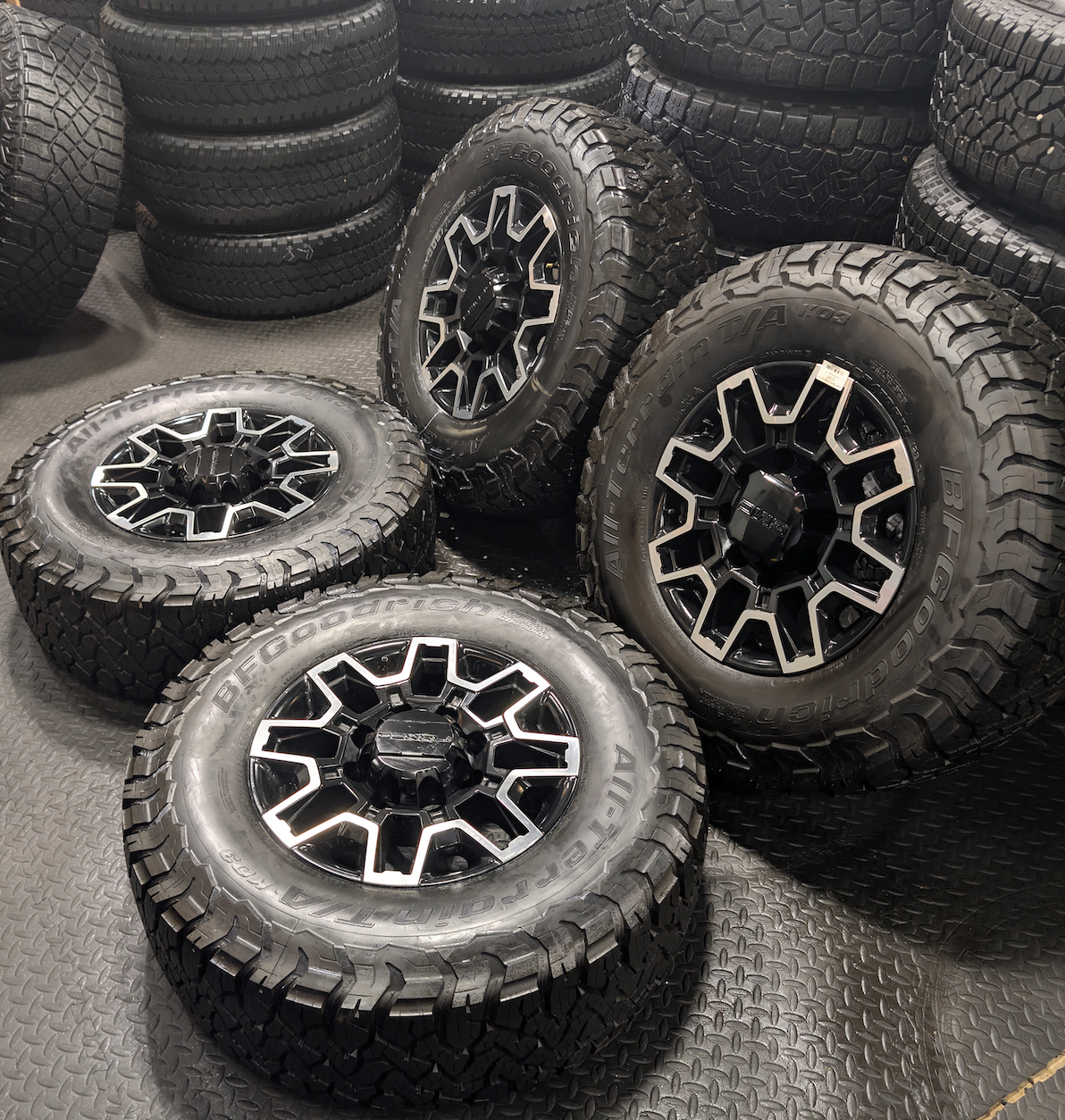 OEM 18” GMC Sierra 2500HD Wheels with Machined Black Finish wrapped in LT305/70R18 BFGoodrich All-Terrain T/A KO3 tires.