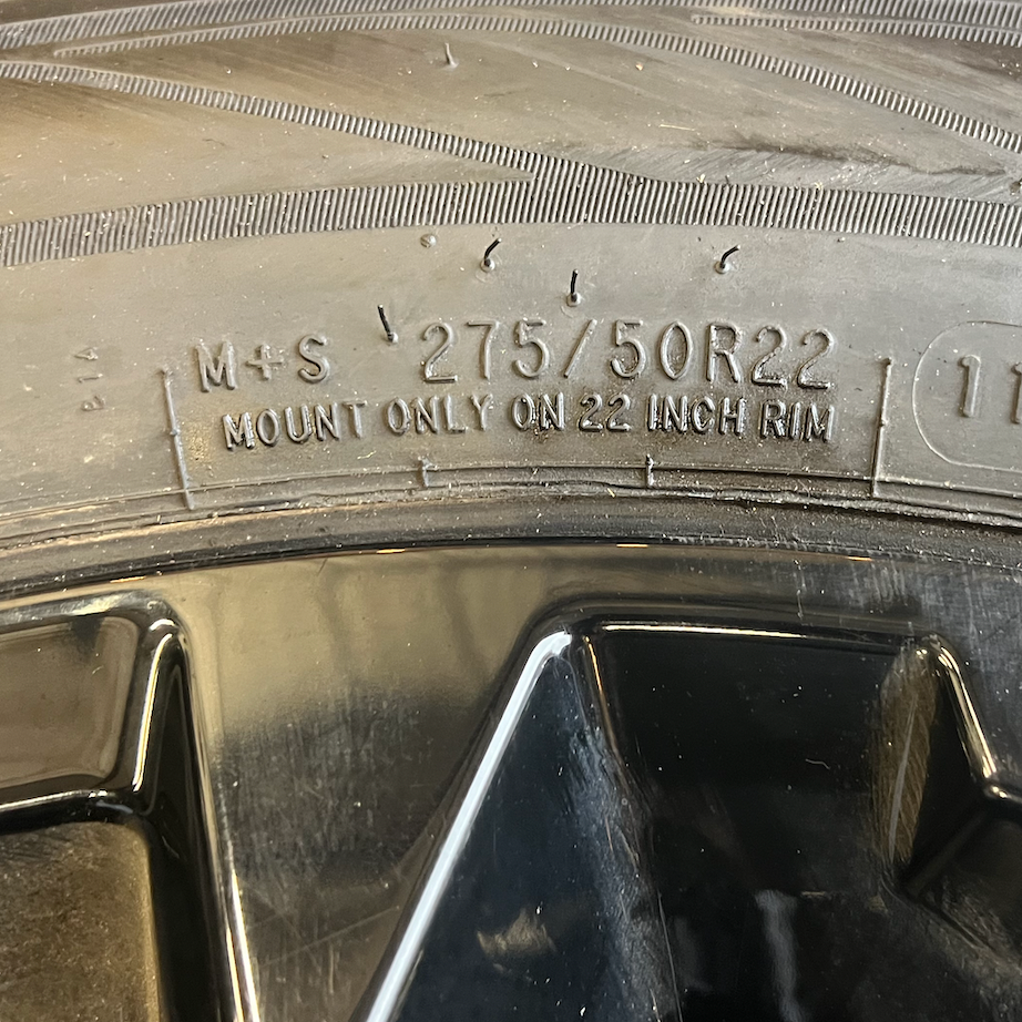 OEM 22” Gloss Black Chevrolet Wheels wrapped in Cooper ProControl tires.