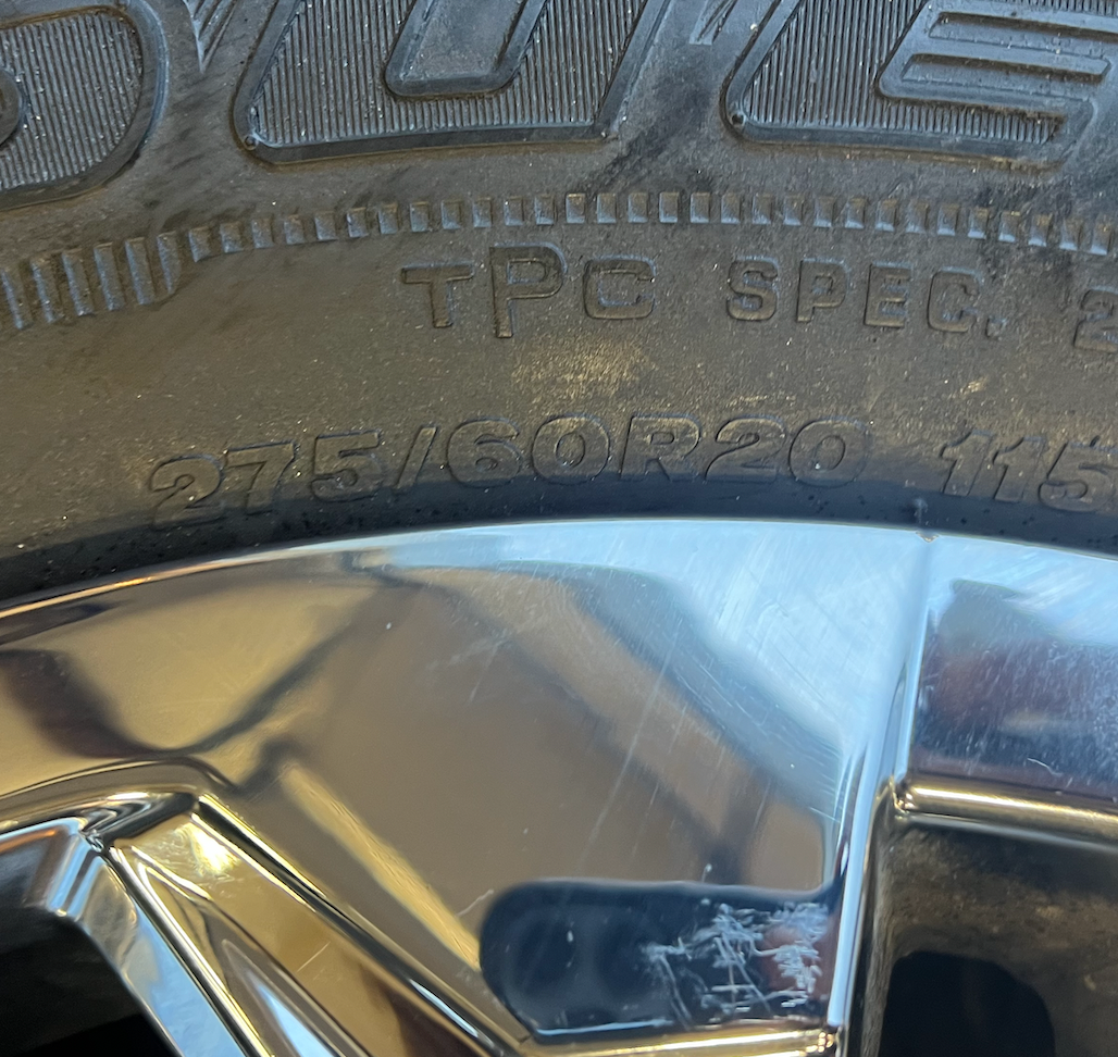 OEM 20” Chrome Wheels wrapped in Bridgestone Dueler tires.