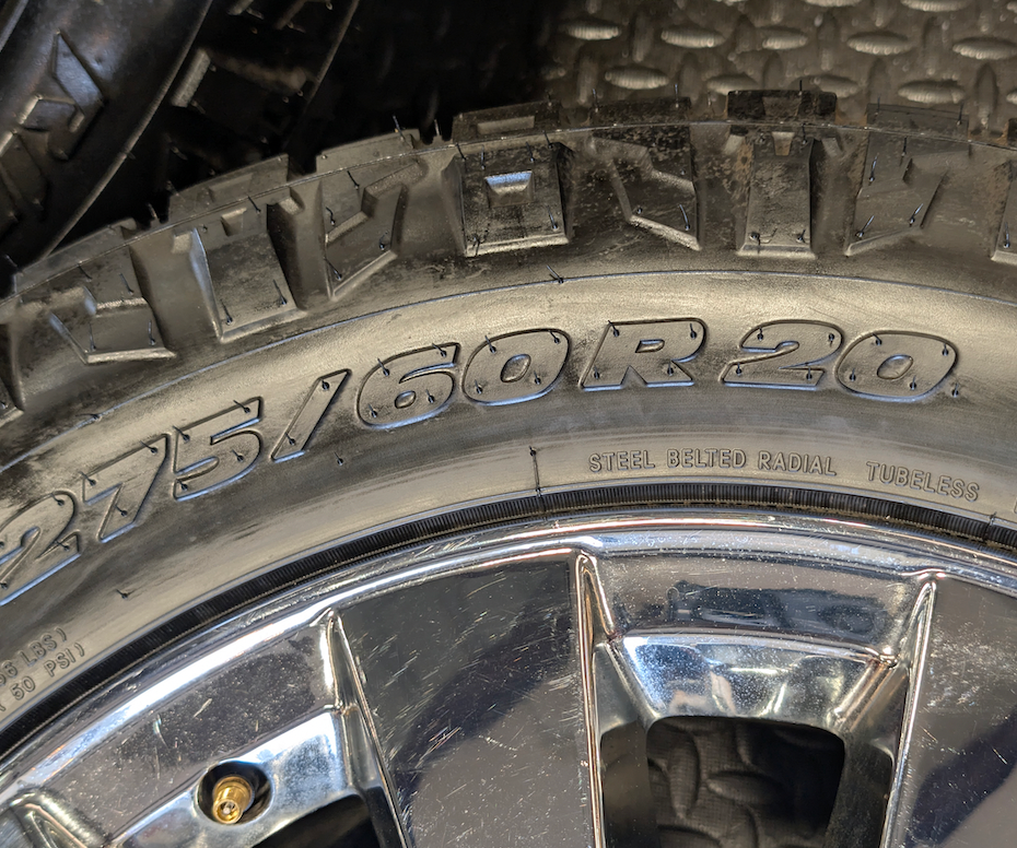 OEM 20” Chrome GMC Sierra Denali 2500HD / 3500HD Wheels wrapped in LT275/60R20 Nitto Ridge Grappler tires.