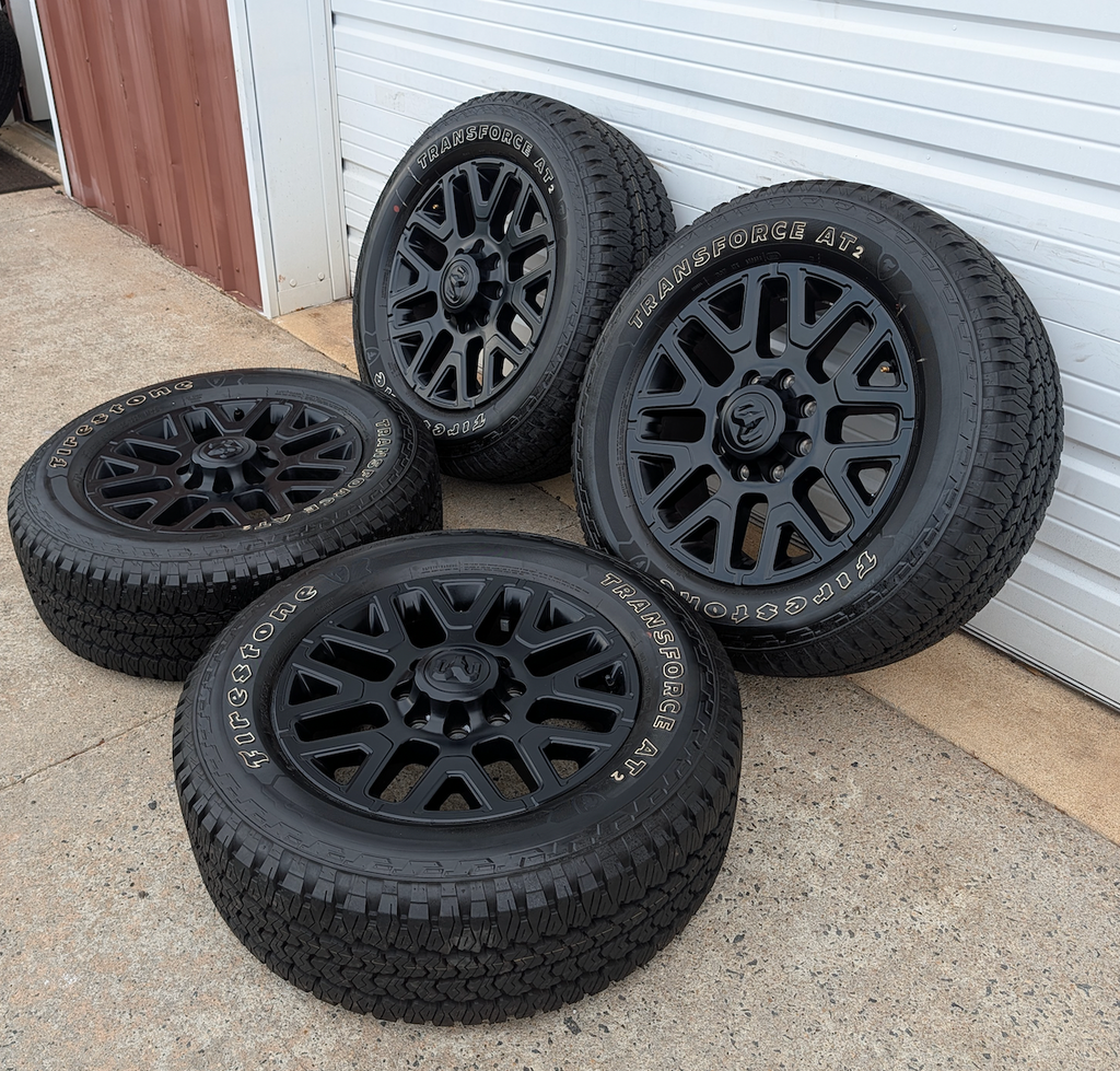 Matte Black Ram 2500 / 3500 OEM 20” Wrapped in Firestone Transforce AT2 LT285/60R20