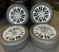 OEM 22” Polished Aluminum Wheels wrapped in Bridgestone tires.