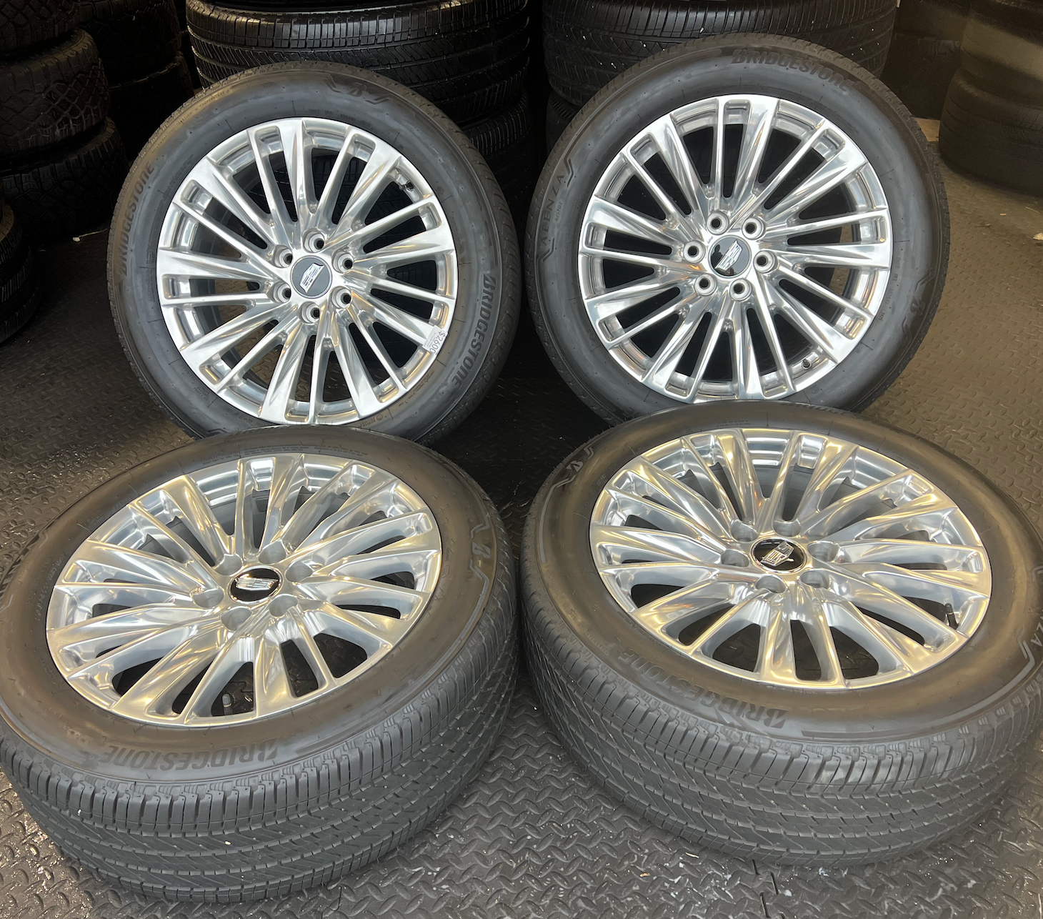 OEM 22” Polished Aluminum Wheels wrapped in Bridgestone tires.