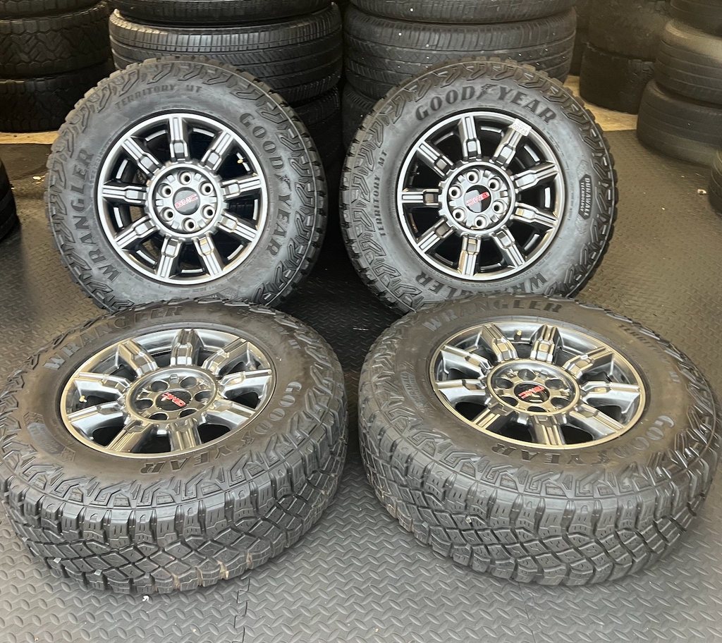 OEM 18” AT4X machined aluminum Wheels wrapped in Goodyear Wrangler Territory M/T tires.