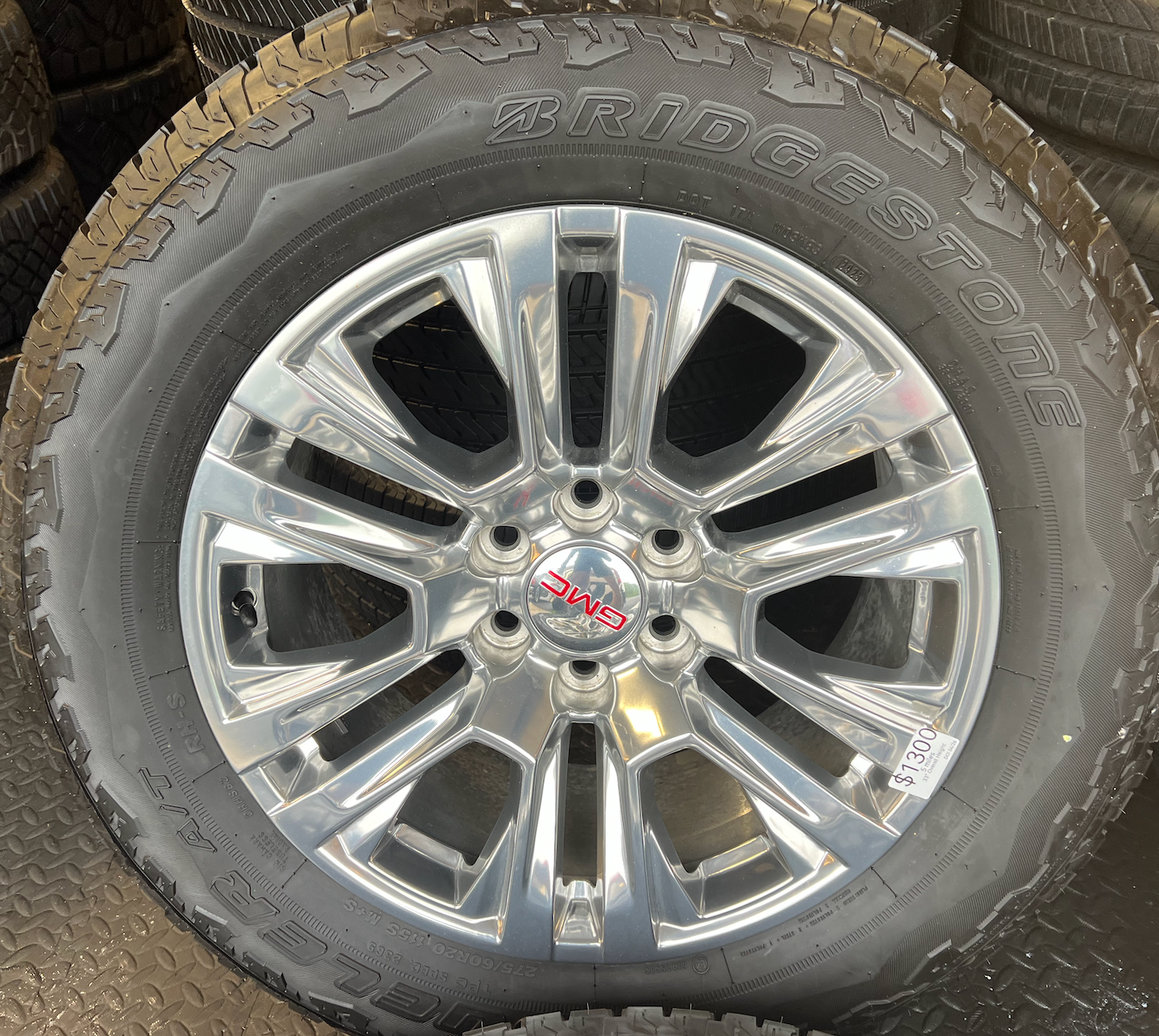 OEM Rebuilt 20” Polished Wheels wrapped in Bridgestone Dueler tires.
