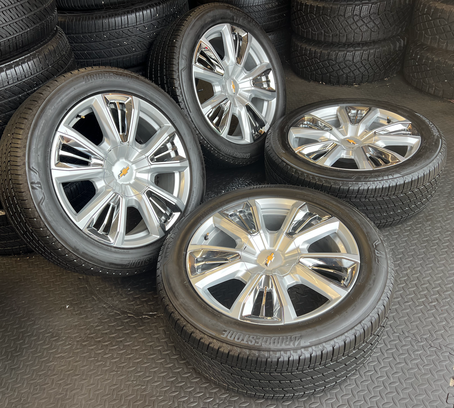 OEM 22” Chevrolet High Country Wheels wrapped in Bridgestone tires.