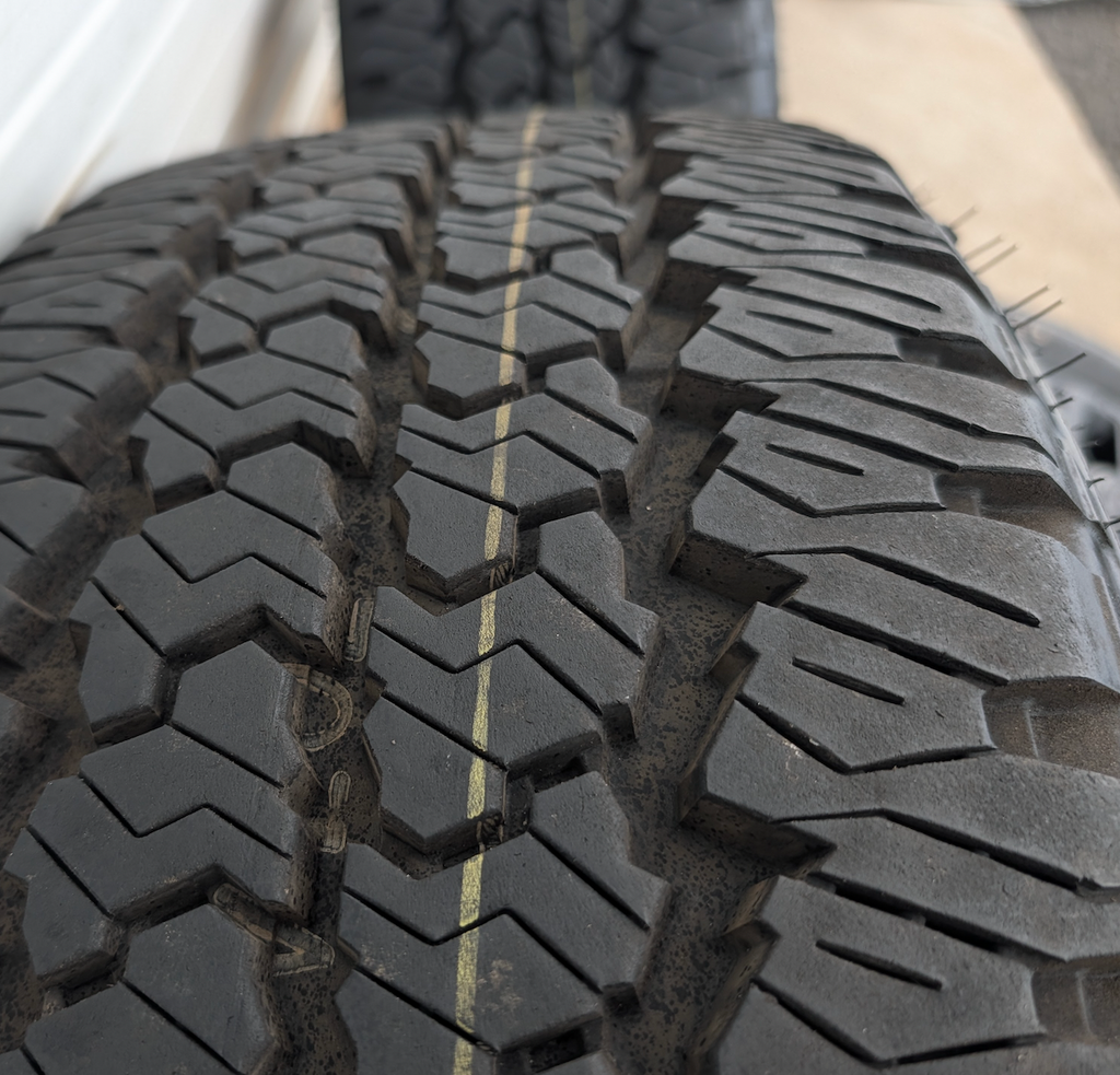 Matte Black Ram 2500 / 3500 OEM 20” Wrapped in Firestone Transforce AT2 LT285/60R20