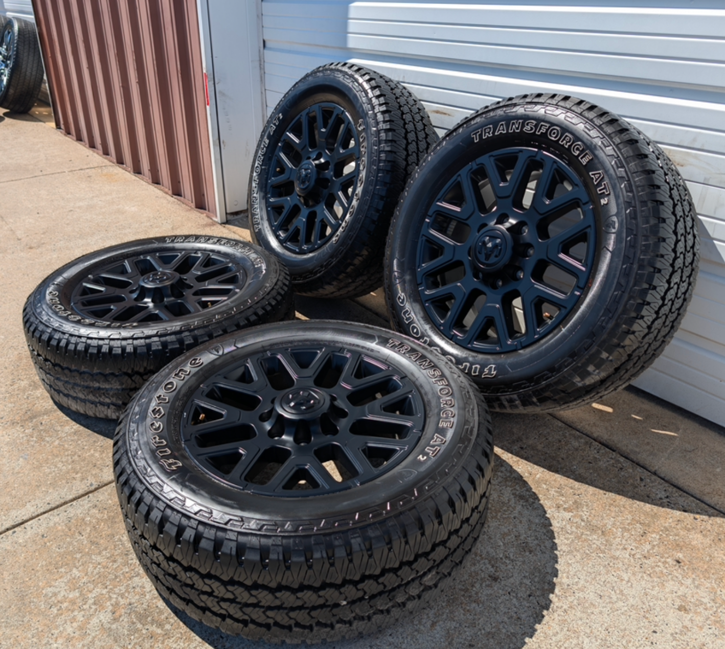 OEM 20” Matte Black Dodge RAM 2500 / 3500 Wheels wrapped in LT285/60R20 Firestone Transforce AT2 tires.