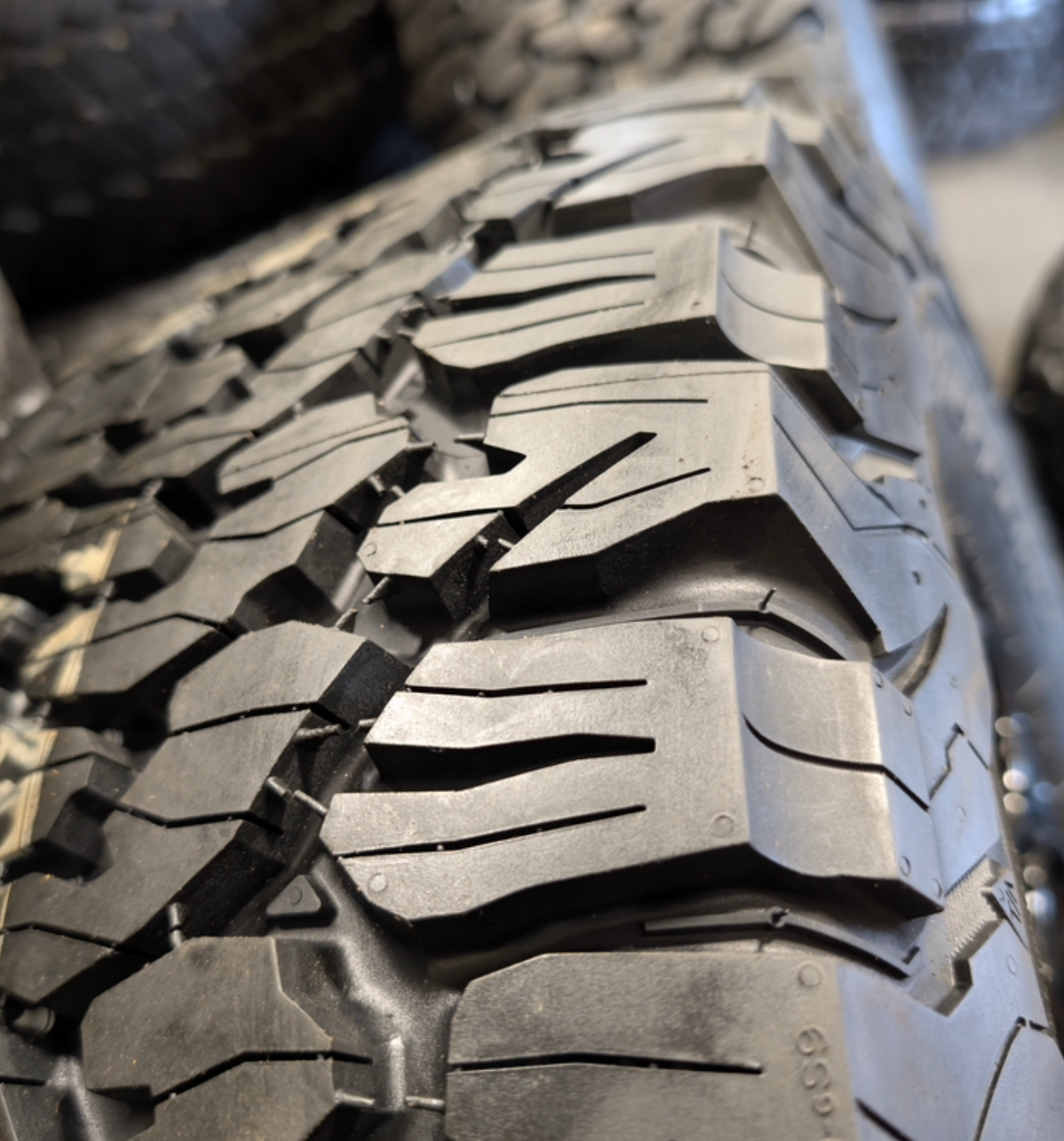 OEM 20” Gloss Black Ford F-250 / F-350 Tremor Lariat BAP Wheels wrapped in 35x12.50R20LT BFGoodrich All-Terrain T/A tires.
