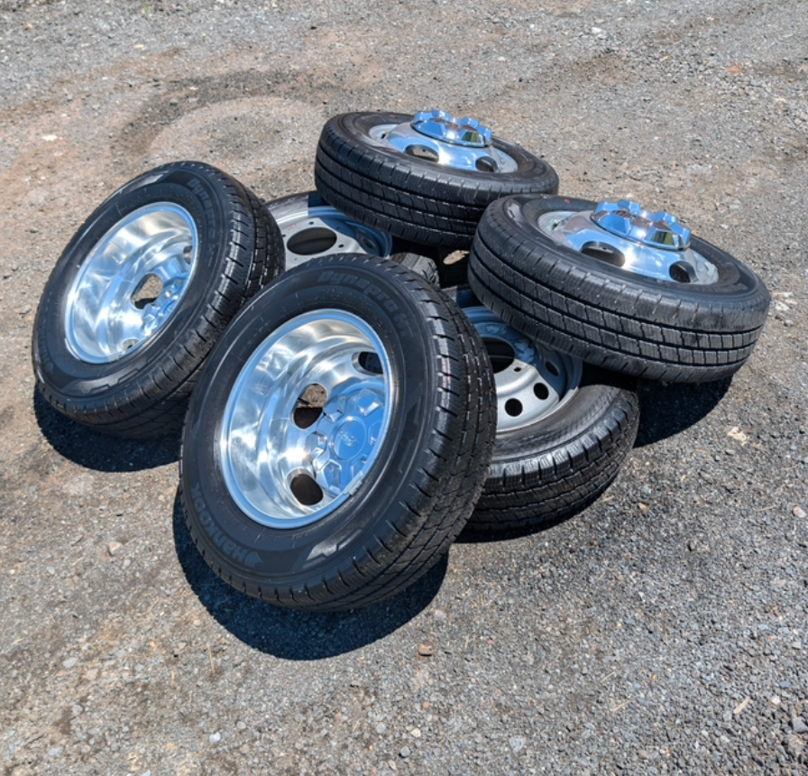 OEM 16” Polished Ford Transit Dual Rear Wheel (Dually) Wheels wrapped in 205/75R16 Hankook Dynapro HT tires.