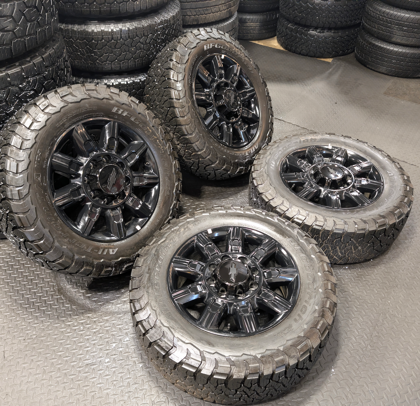OEM 20” Gloss Black Chevrolet Silverado 2500HD / 3500HD Wheels wrapped in BFGoodrich All-Terrain T/A KO3 tires.