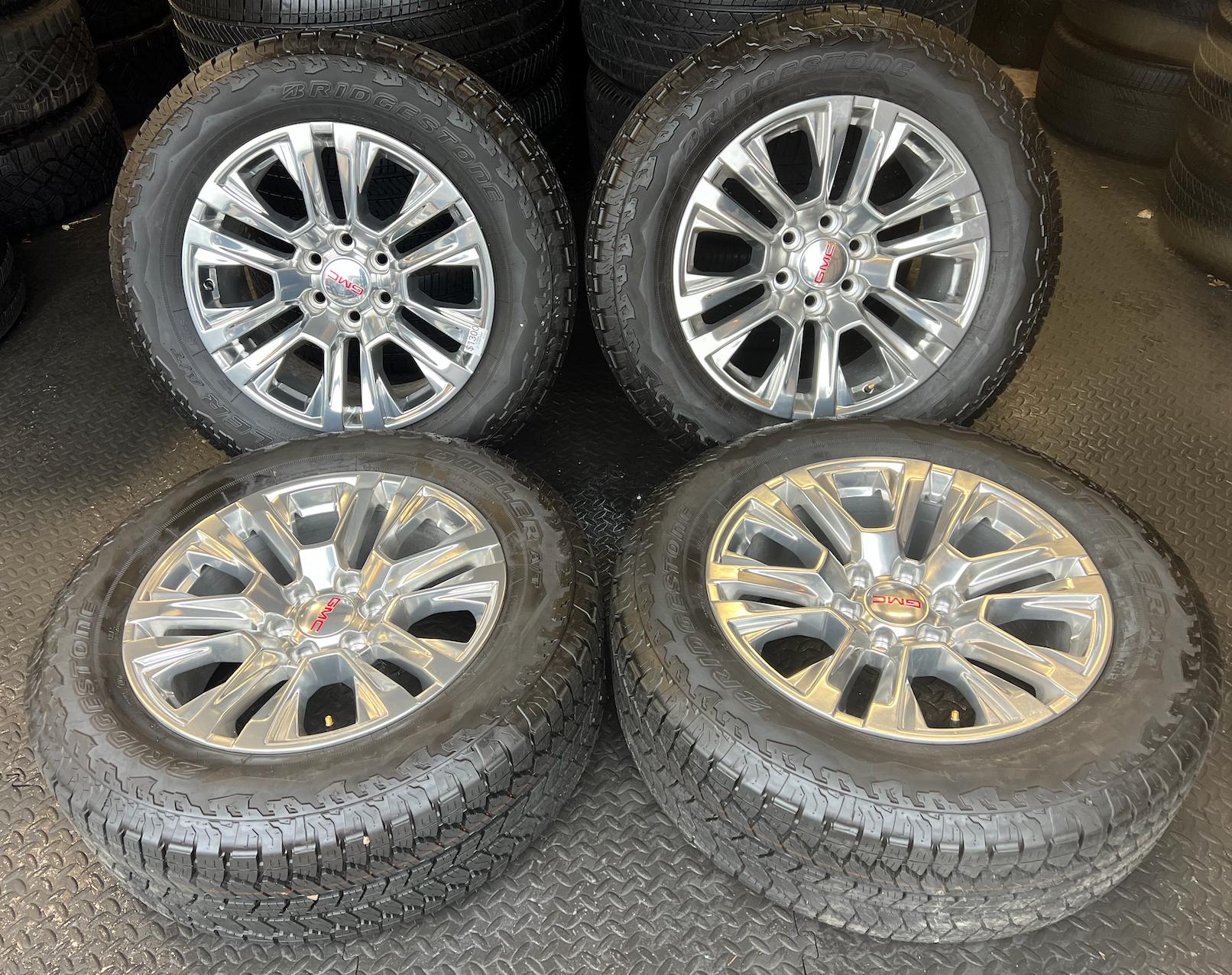 OEM Rebuilt 20” Polished Wheels wrapped in Bridgestone Dueler tires.